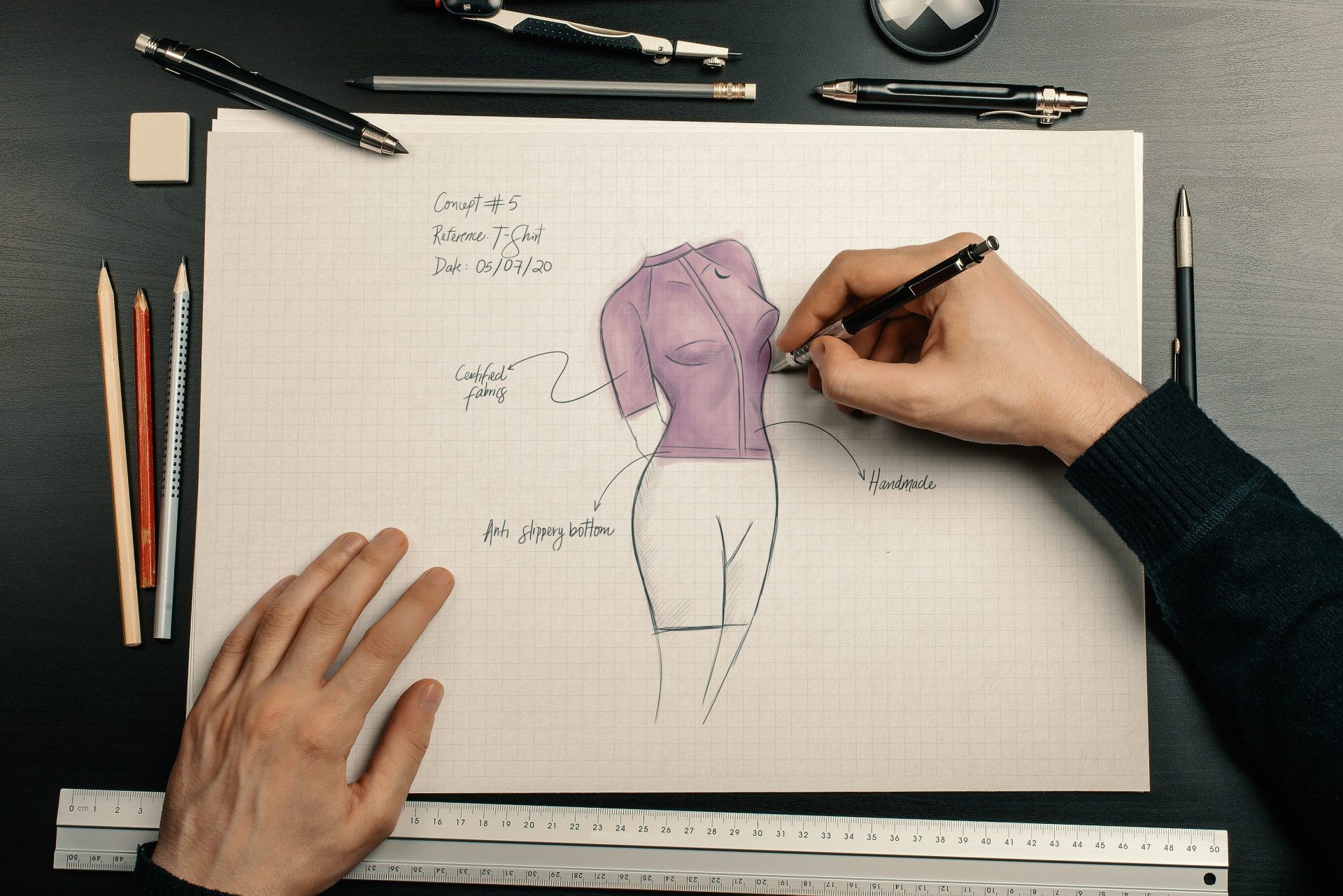 person holding purple balloon on white printer paper